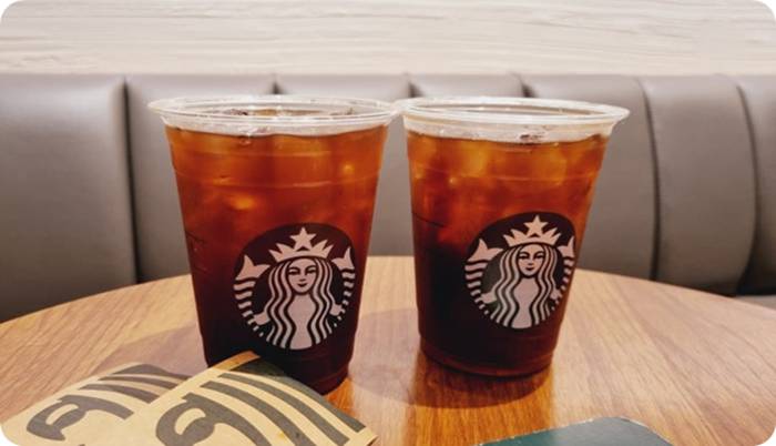 two cups of iced coffee on a table